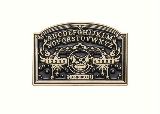 Gold plated ouija board enamel pin