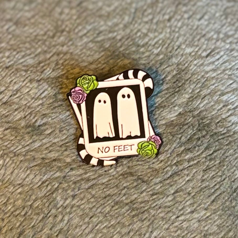 No feet Beetlejuice style enamel pin