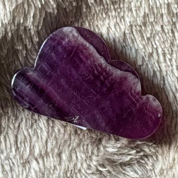 Purple fluorite cloud carving